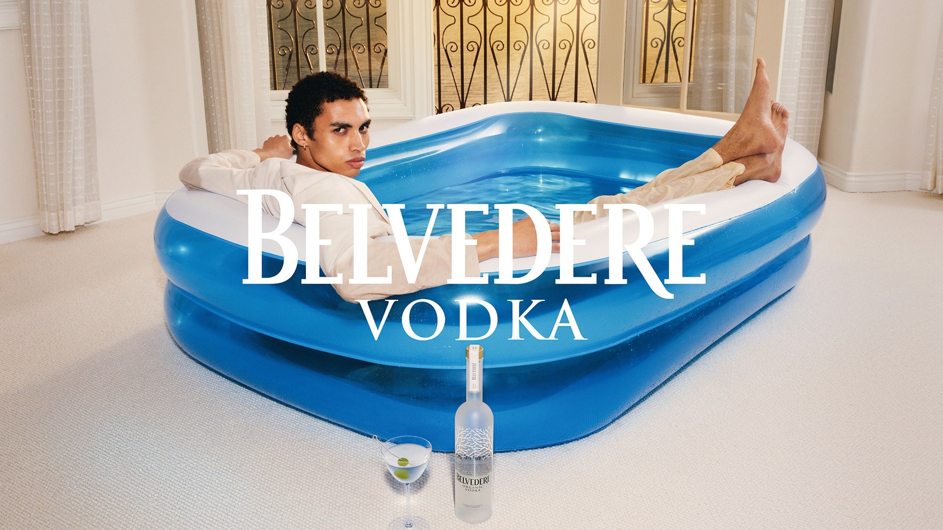 Belvedere and Tyler Mitchell - Man in a small pool behind a Belvedere Organic bottle 