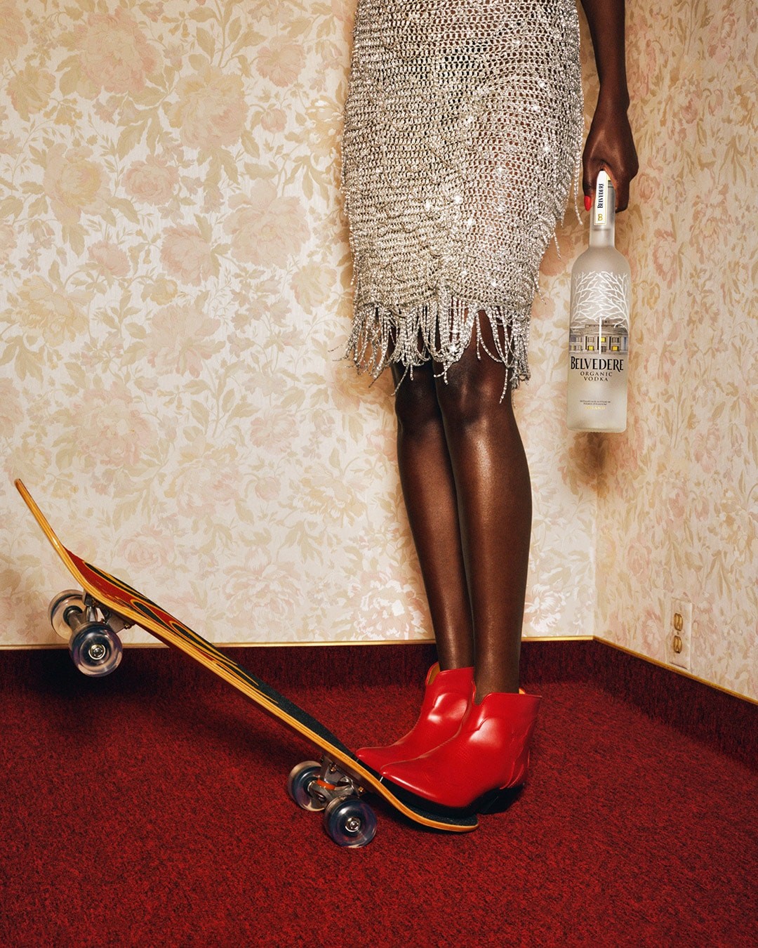 Belvedere and Tyler Mitchell - Woman holding a Belvedere Organic bottle and standing on a skateboard
